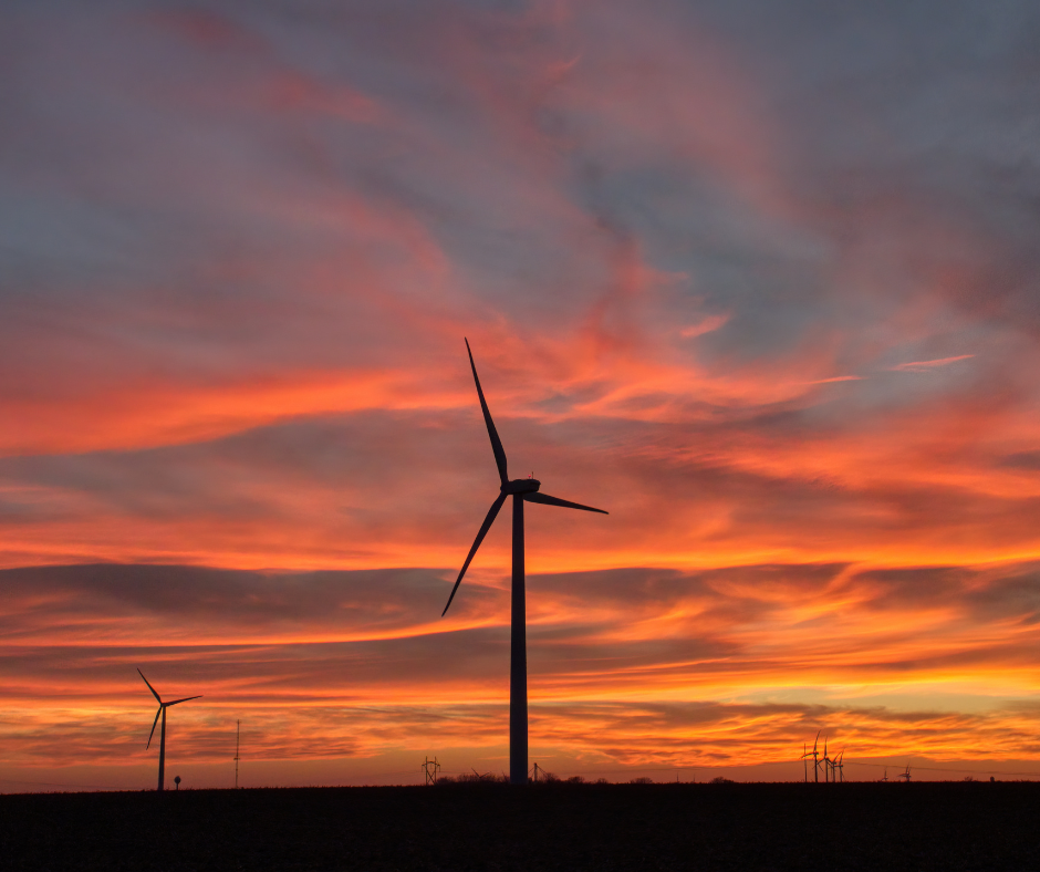 power turbine with sunset red sky in background